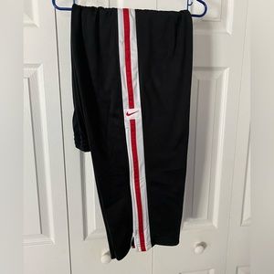 Black Nike track pants, men’s L, red and white stripe, zipper ankle
